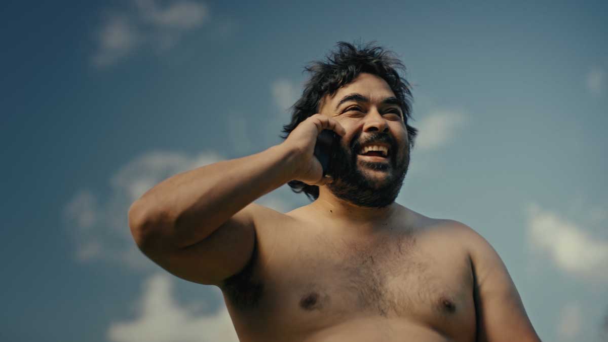 Man on the phone with no shirt on